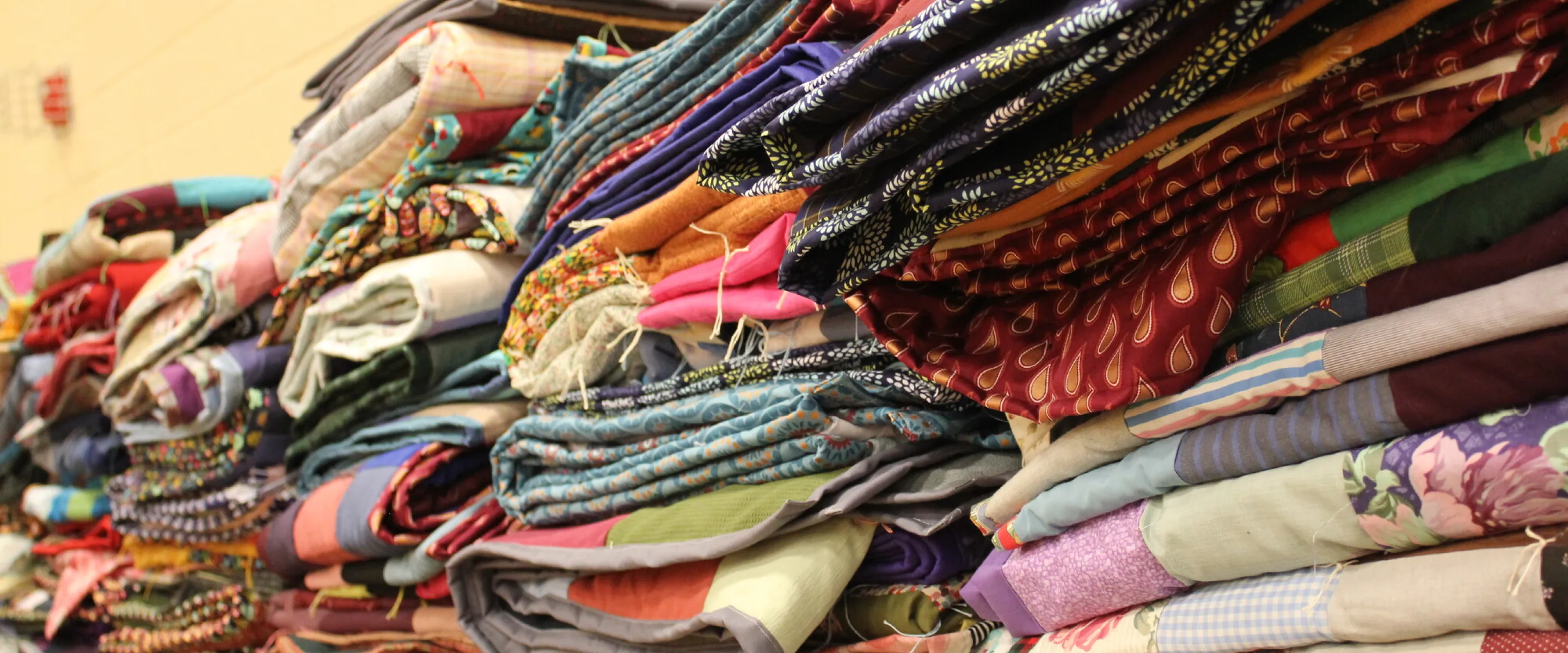 Finished comforters at the 2025 Ohio MCC Comforter Bash.