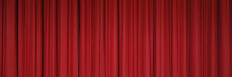 A red curtain as if on a performance stage.