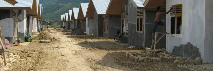 A row of houses in Indonesia that are being worked on.