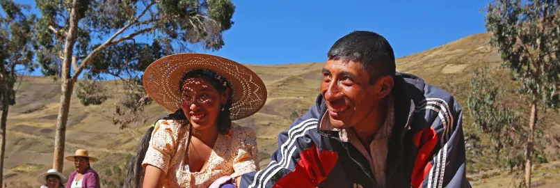 Sofia Perez, left, helps her brother, farmer German Perez Saénz rotate his maca crop as it dries.