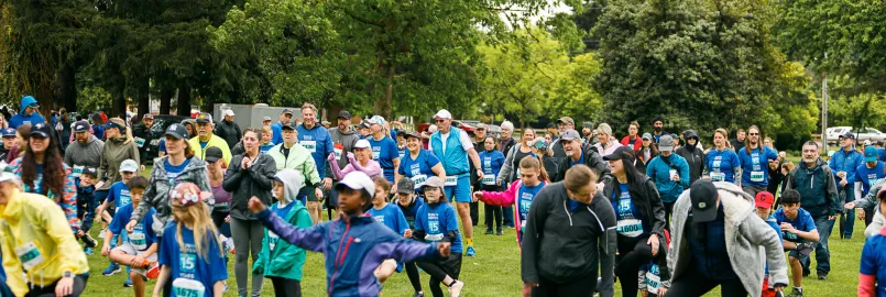 A group of people gather in a park