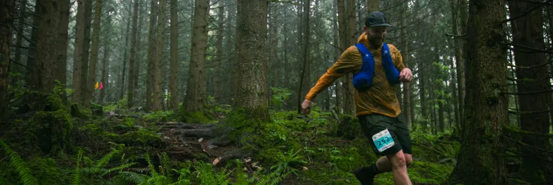 Man running through a forest