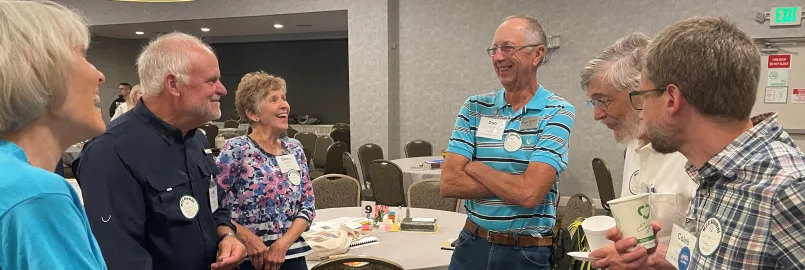 Alumni visit and laugh together