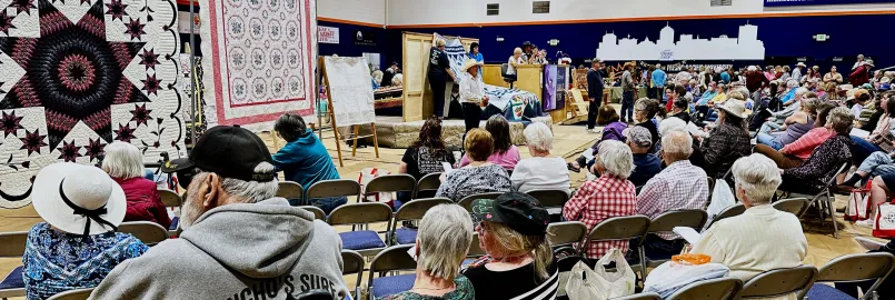 crowd at quilt auction