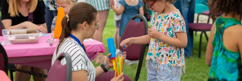 A volunteer and child interacting
