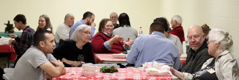 people talking around tables