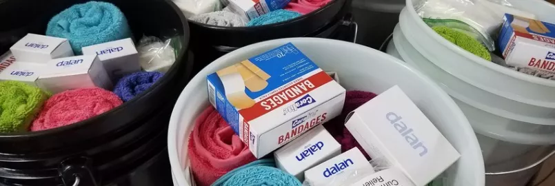 Relief kits await lids at the Material Resources Center in Ephrata, PA. Relief kits include:

	
		4 large bars bath soap 
	
		1 plastic bottle shampoo (13–24 oz; place in resealable plastic bag)