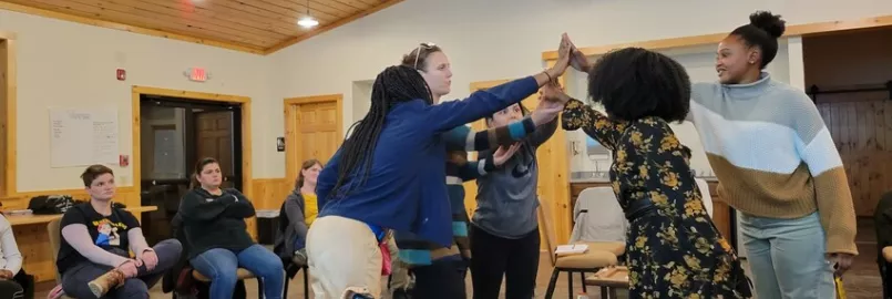 Participants in the week-long "Peace for the weary" camp for young adults held at Camp Deerpark in January build a symbol of reconciliation representing truth, mercy, peace and justice. Pictured from