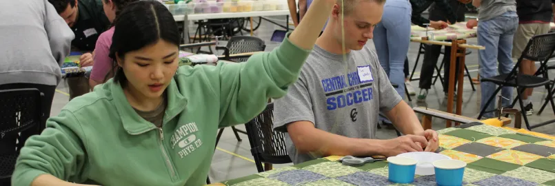 Rosa Kim and Jake Hofstetter were two of the high school seniors from Central Christian School who spent Friday afternoon volunteering at the 2022 Ohio Comforter Bash in Kidron, Ohio.