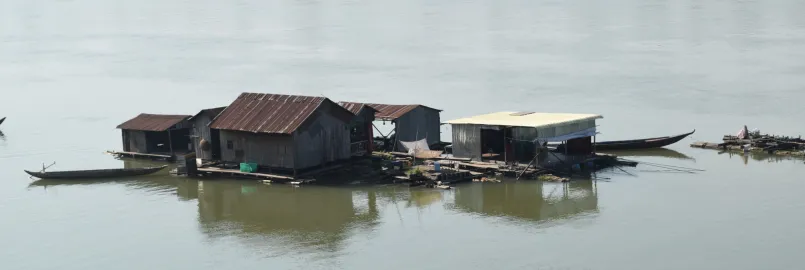 A floating village of "boat people" temporarily anchors on the upstream Mekong river in Kratie province, Cambodia.