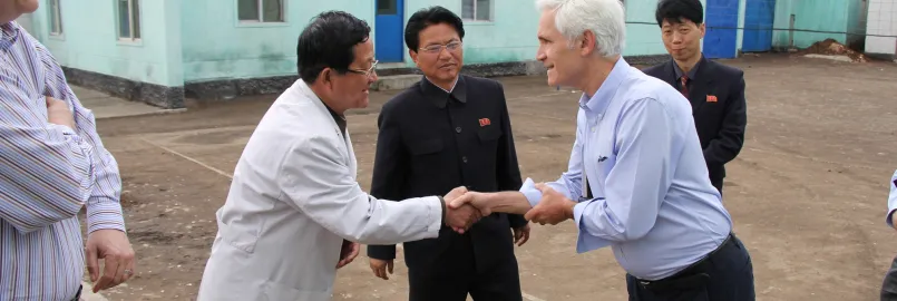 Chris Rice, MCC representative for Northeast Asia, with a pediatric hospital director at a provincial pediatric hospital in the Democratic People’s Republic of Korea (DPRK)*.

	MCC sent 520 cartons