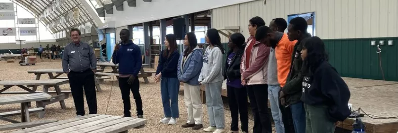 2023-24 East Coast IVEP participants share at the alumni and friends gathering at the 2023 Virginia Mennonite Relief Sale in Harrisonburg, Virginia.