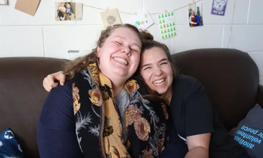 Two young adult staff serving in Jordan and Vietnam with MCC's SALT program