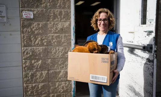 Thrift shop volunteer accepting donations