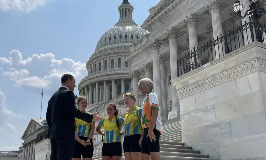 Four cyclists with the Center for Sustainable Climate Solutions meet with Senator Todd Young (R-Ind.) at the U.S. Capitol on July 28, 2021. The Climate Riders spent two months this summer riding from
