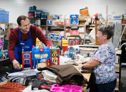 Thrift store volunteers sorting donated items