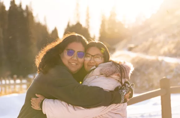 Two women hugging