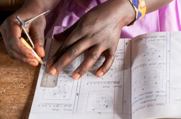 A student writing in her notebook.