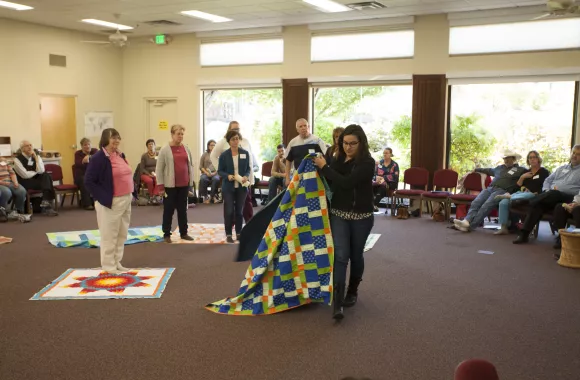 Group of people participating in a blanket exercise
