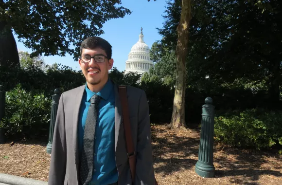 Andres Mata, a member of the Volunteer Advocacy Coordinators Network (VACN)  stands outside of the Capitol building in Washington DC in between “Hill visits”, constituent meetings with congressional representatives and their staff on Capitol Hill. 