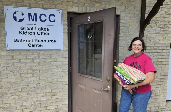 Lady dropping off materials at the MCC Great Lakes office in Kidron