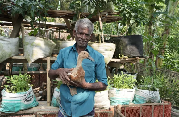 Man holding a duck.