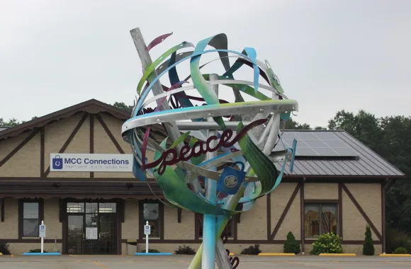 metal sculpture with intertwined ribbons of aluminum