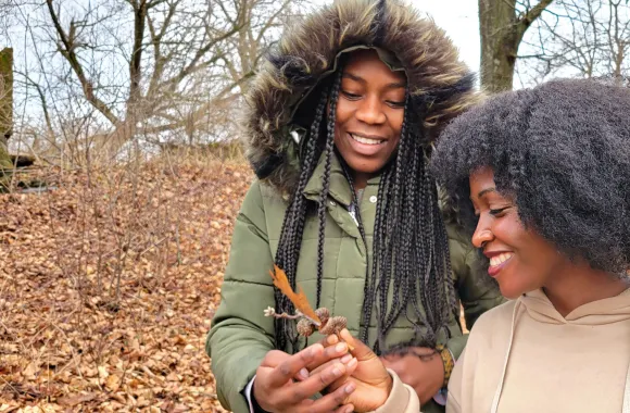 Josephine Kalondji, left, and Mwajuma Katembo admire an oak leaf while on a nature walk at Freedom Farm. 

Participants in the week-long "Peace for the weary" camp for young adults visited Freedom F
