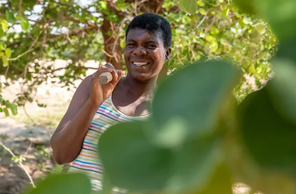 Sipho Nyoni takes a break from working in her fields in Binga district during an MCC visit in December 2024.
