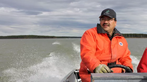 A man driving a boat