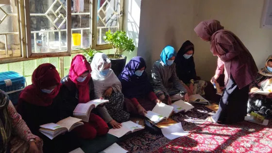 Women learning in a school in Afghanistan