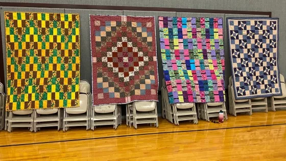 Quilts hanging on a wall