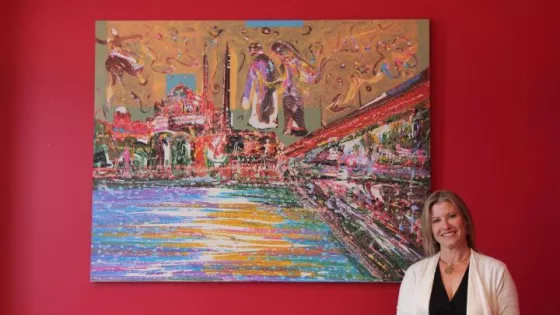 women standing beside painting from Memduh Kuzay