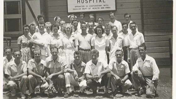 a group of people in the 1940s in front of a clinic in puerto rico