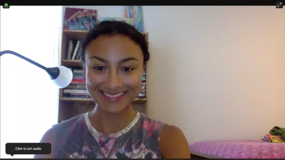 A woman smiling on a Zoom video call