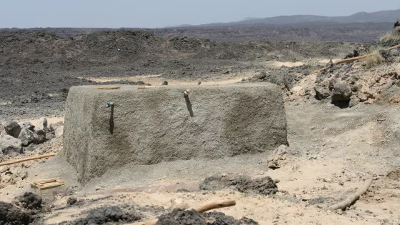 A large cement looking block in the middle of the desert in Ethiopia