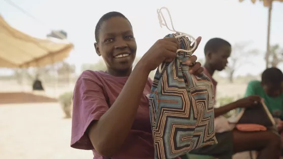 girl holds dignity kit