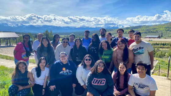 group of young adults outside in front of mountains Colorado