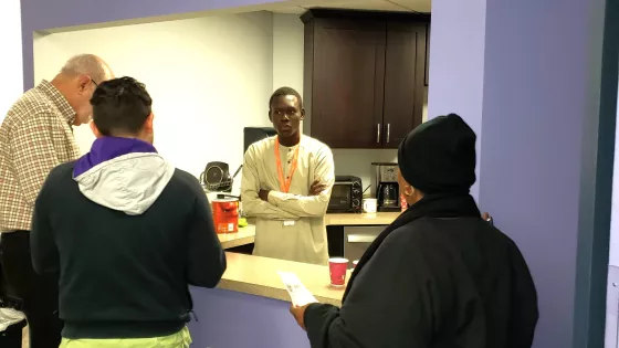 Adonis Kodjihiti engages with students during break at Esperanza Center.