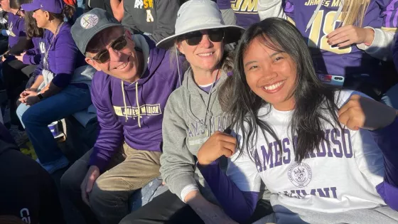 From left: Eric Bendfeldt, Mary Bendfeldt and Hulda Sharon watch an NCAA college football game at James Madison University in Harrisonburg, Virginia.