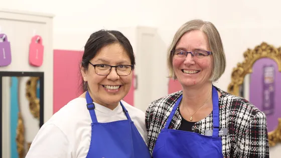 thrift staff and volunteer in thrift store