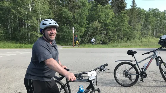 Kyle Rudge with his bike at Cycle Clear Lake