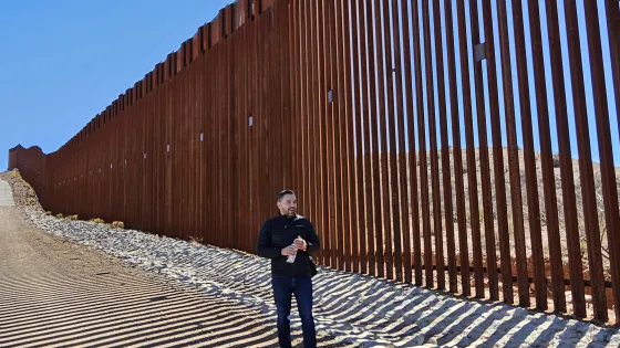 Man stands in front of wall