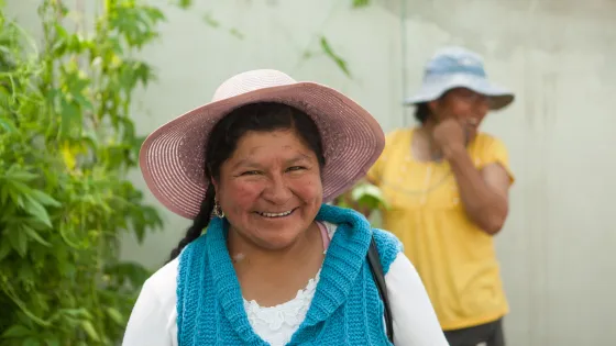 A woman smiles at the camera