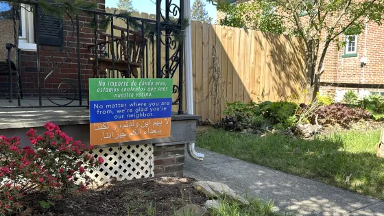 tri-color welcome sign in a yard