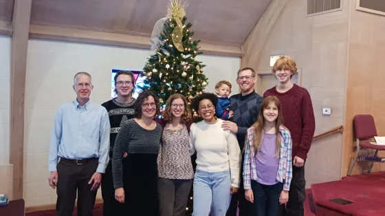 Family picture in front of Christmas tree