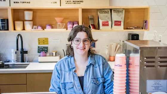 Sam's Place barista Wren Hildebrandt behind the counter