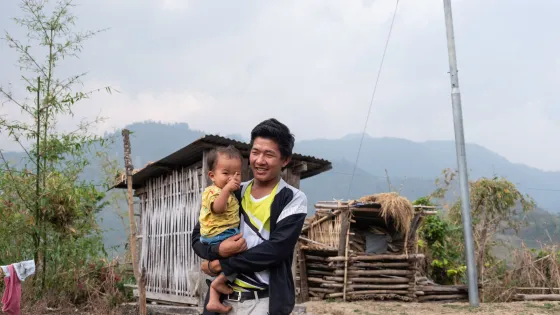 Ishwor Man Magar with his son Funcha Magar (15 months) in Kerabari Rural Municipality-3 in Morang, Nepal on Saturday, April 20, 2024. He lives with his son, wife, and parents.