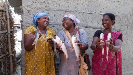 From left: Shova Beshra (33), Kalpana Kumari Marandi(30) and Chanmuni Tudu Satar (31) are showing fish before taking them to the local farmers’ market at Santhal Tole, Jahada Rural Municipality- 5,