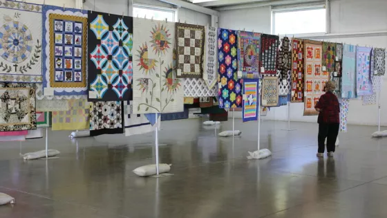 A preview of quilts and other online auction items for the Ohio Mennonite Relief Sale coincided with a drive-thru food event in Kidron, Ohio, in September 2020.